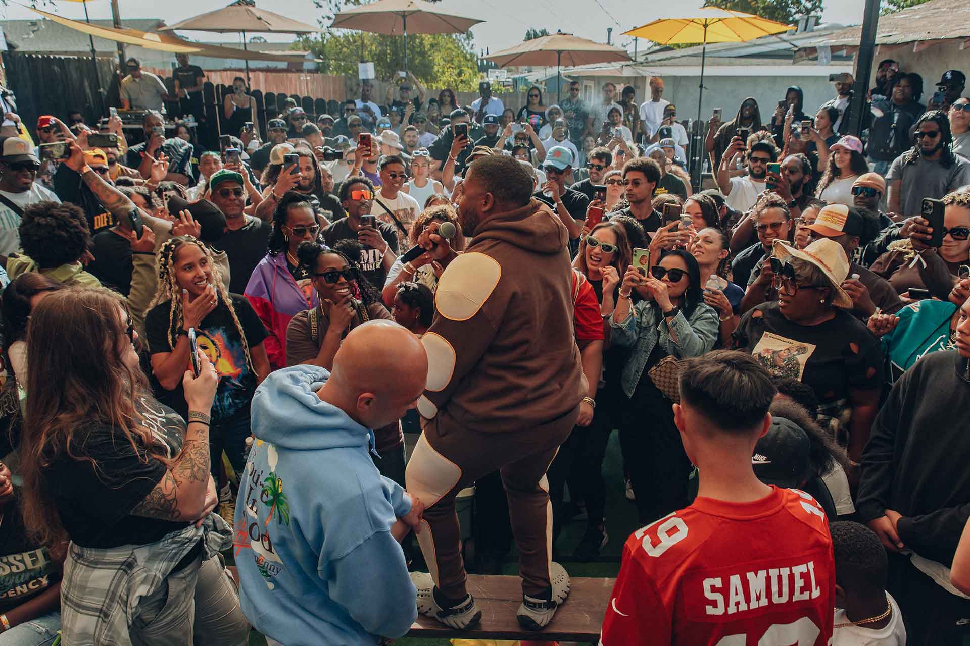 LaRussell performing among the crowd at his Vallejo backyard show